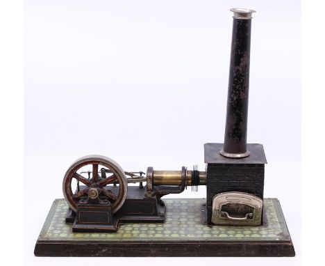 Live Steam: An early 20th century, horizontal live steam, stationary engine, single cylinder, flywheel approx. 4", unmarked, 