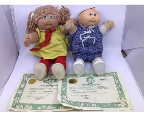 Cabbage Patch Kids: two hard face 1980’s dolls with birth certificates, Malina Raquel and Nathaniel Barclay. please study ima