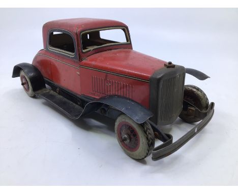 Chad Valley: A Chad Valley tinplate clockwork two door coupe. Some play/age wear. Missing steering wheel. Motor works. (No ke