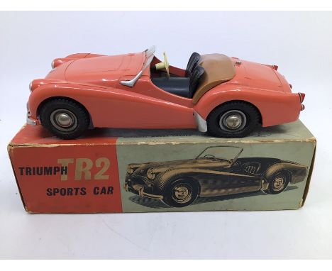 Victory: A boxed Victory Industries, Surrey, battery operated, 1:18 Scale, Triumph TR2 Sports Car, salmon pink body with blac