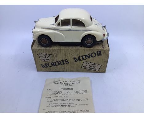 Victory: A boxed Victory Industries, Surrey, battery operated, 1:18 Scale, Morris Minor Saloon, ivory white body with red int