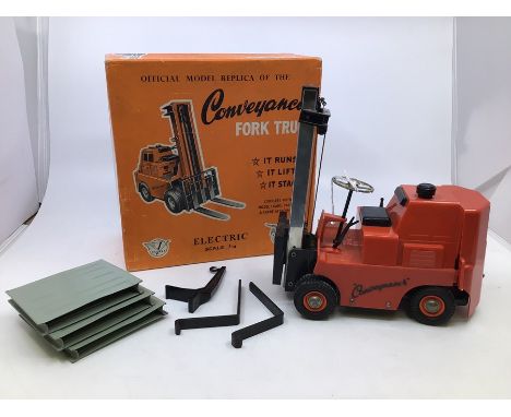 Victory: A boxed Victory Industries. Surrey, battery operated, 1:14 Scale, Conveyancer Fork Truck, red body, a little bit of 