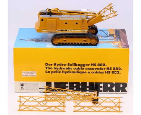 Conrad: A boxed Conrad, Hydraulic Cable Excavator, HS 882, 1:50 Scale, Model 2631, Liebherr, yellow main body, vehicle good, 