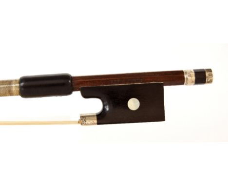 German silver mounted violin bow stamped Albin Hums, the stick round, the ebony frog inlaid with pearl eyes and the ebony adj