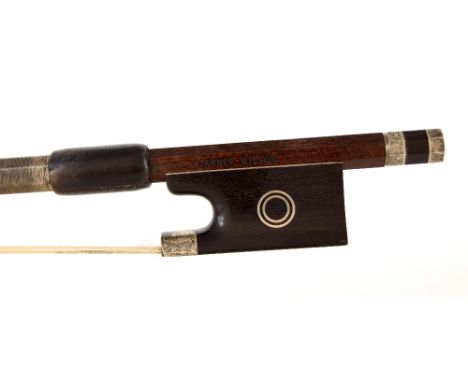 English silver mounted violin bow by and stamped Garner Wilson, the stick octagonal, the ebony frog inlaid with double silver