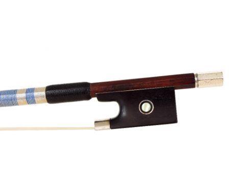 Silver mounted violin bow, indistinctly stamped, the stick round, the ebony frog inlaid with silver rings enclosing pearl eye