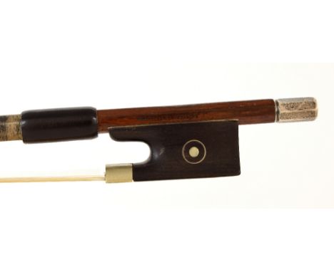 German silver mounted violin bow by and stamped Arnold Voigt, the stick octagonal, the ebony frog inlaid with silver rings en