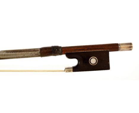 German silver mounted violin bow by and stamped *Albert Nurnberger*, the stick round, the ebony frog inlaid with silver rings