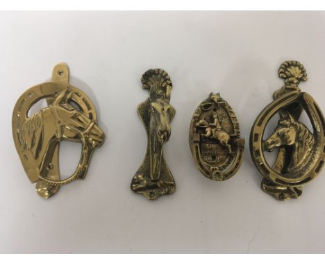 Four cast brass door knocker in the form of horses heads and shoes (4)