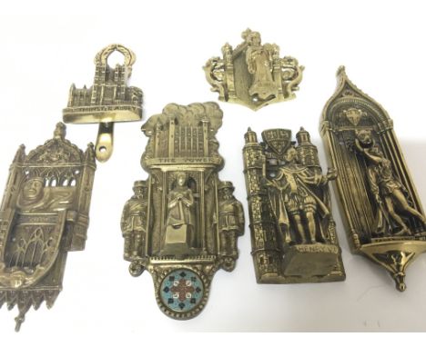 A collection of cast brass and enamel decorated door knockers of Gothic design including the Tower of London with figures Hen