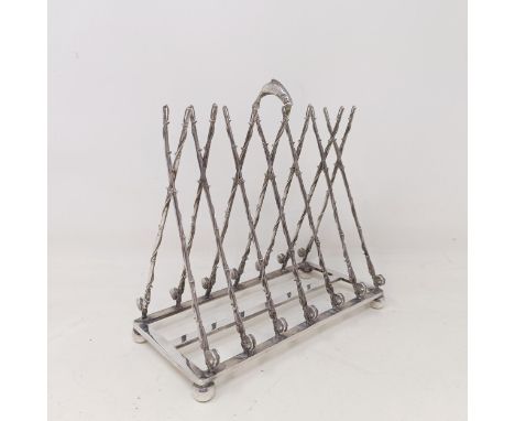 A late Victorian silver plated novelty toast rack, the divisions in the form of fishing rods and reels, 16 cm wide