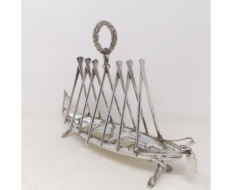 A late Victorian silver plated novelty toast rack, in the form of a rowing boat, the divisions in the form of oars, 26 cm wid