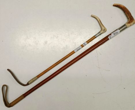 A riding crop, with a silver mount, and another (2)