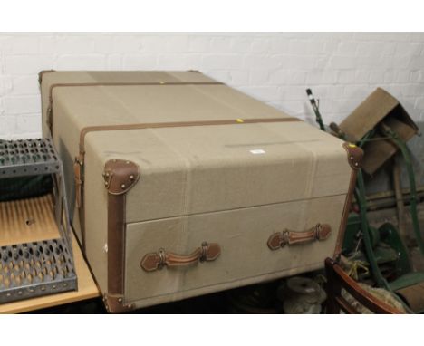 A LARGE STORAGE UNIT IN THE FORM OF A TRAVEL TRUNK WITH TWO DRAWERS