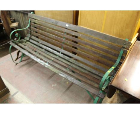 A METAL FRAMED AND WOODEN GARDEN BENCH