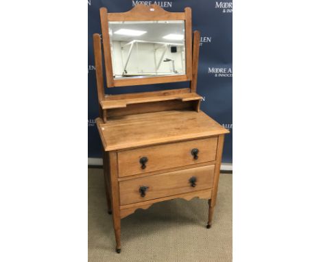 An early 20th Century oak dressing chest of two drawers with mirrored superstructure, 76 cm wide x 43.5 cm deep x 151 cm high