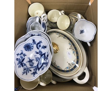 A collection of Meissen "Blue Onion" pattern tea wares comprising five cups, three saucers and a miniature jug and a small co