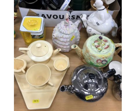 A collection of various teapots and water jugs including Carlton ware "Tumbling Clowns" teapot (3351), Wade "Bird's nest", "Y