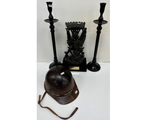 An Indonesian carved hardwood figure group of Vishnu and Garuda 31 cm high on a black velvet covered block base bearing plaqu