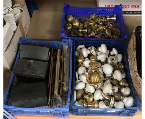 Three boxes of assorted door furniture to include porcelain door knobs, brass door knocker, brass finger plates, etc, letter 