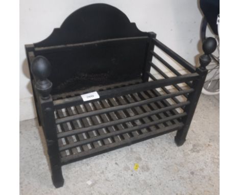 A modern cast iron fire basket of plain form with built in fire back 30.5 cm deep x 45.5 cm wide x 41 cm high, together with 