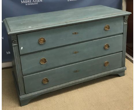 A 19th Century French painted commode, the plain top with applied moulded edge over three long drawers, each decorated with p