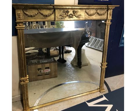A modern giltwood and gesso framed overmantel mirror in the Georgian style, the moulded cornice with cherub and wreath centra