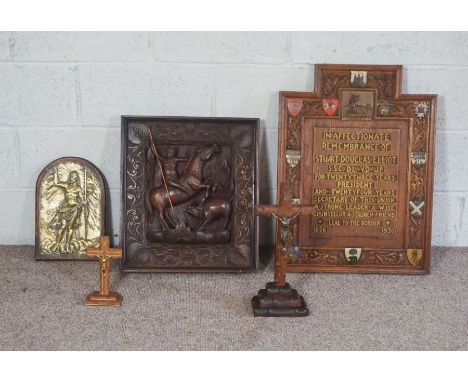 A Continental carved wood panel, of a man hunting on horseback; together with brass religious plaque, embossed with image of 