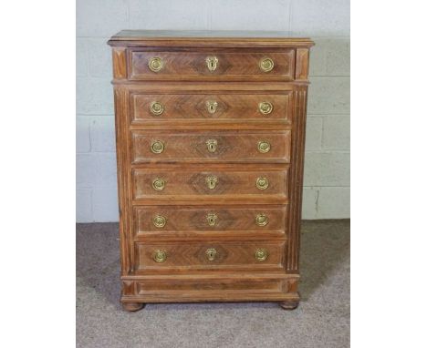 A Louis XVI style walnut chest of drawers, with a moulded top over six drawers, 120cm high, 80cm wide