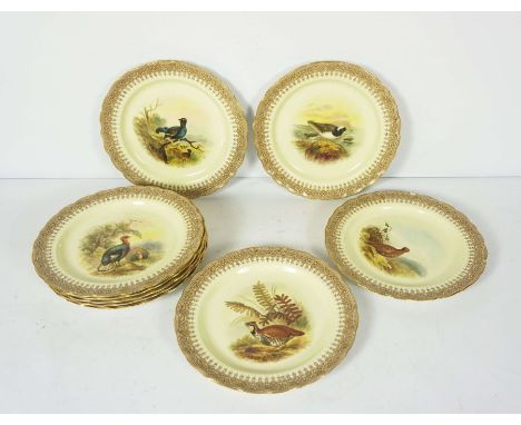 A set of nine Royal Worcester vitreous plates, hand painted with game birds, including Black and Red Grouse, Plover, Wild Tur