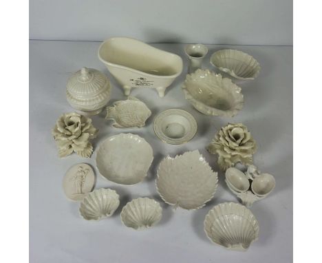 A quantity of blanc de chine decorative ceramics, including flower heads, a model of a hip bath and a table salt with putto s