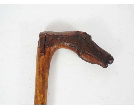 A beautifully carved walking stick, the handle carved with a horses head, inscribed ‘KEPKYPA’, Corfu, 19th or early 20th cent