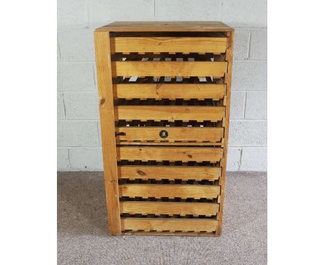 A ten drawer pine apple store, by E.H Taylor, with slatted drawers