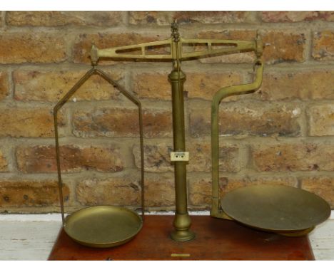 A set of late 19th / early 20th century scales, mounted on wooden base, marker's mark 'May Roberts & Co. Ltd London'. H.44cm.