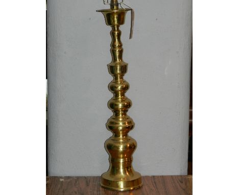 A brass floor standing lamp base of knobbed design..80cm.