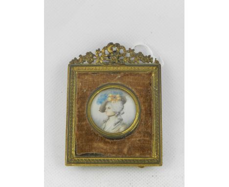 Early 19th Century Continental school, a circular head and shoulder miniature portrait of a lady with gold and sapphire hat p