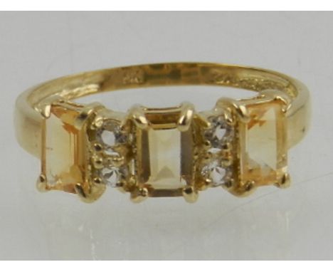 A 9 carat yellow gold, citrine and diamond ring. 
