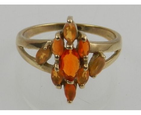 A 9 carat yellow gold and Mexican fire opal cluster ring. 