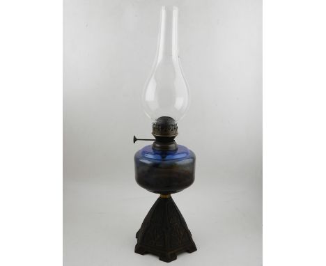 A blue glass oil lamp. H.54cm