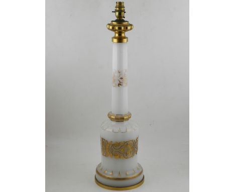 A Bohemian opaque glass top table lamp, decorated with gilt scrolling foliage. H.60cm