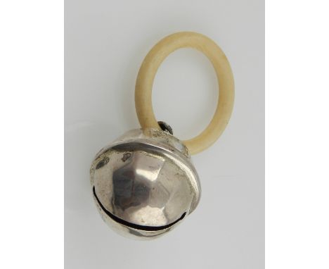 A silver child's rattle, having ivory ring, hallmarked Birmingham.