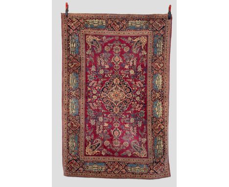 Kashan rug with pictorial main border, west Persia, circa 1920s-30s, 6ft. 8in. x 4ft. 5in. 2.03m. x 1.35m. Some wear in place