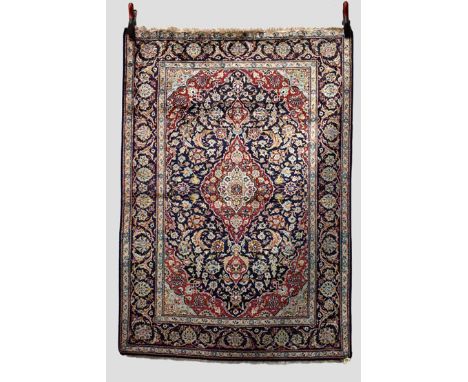 Kashan silk rug, west Persia, circa 1950s, 5ft. 3in. x 3ft. 8in. 1.60m. x 1.12m. Slight loss to top end. Light red centre med