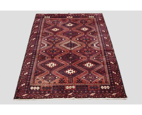 Kurdish carpet, north west Persia, mid-20th century, 8ft. 9in. x 6ft. 2.67m. x 1.83m. Terracotta field with all over pole med