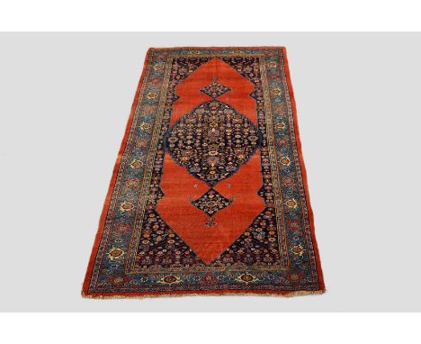 Bijar kelleh carpet, north west Persia, early 20th century, 11ft. 6in. x 6ft. 4in. 3.50m. x 1.93m. Overall wear with losses t