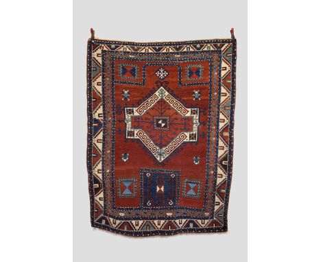 Fachralo Kazak prayer rug, south west Caucasus, late 19th/early 20th century, 7ft. 3in. x 5ft. 6in. 2.21m. x 1.68m. Some wear