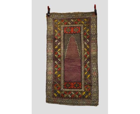 Anatolian prayer rug, possibly Nigde area, central Anatolia, circa 1920s-30s, 5ft. 1in. x 2ft. 9in. 1.55m. x 0.84m. Overall e