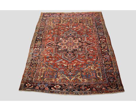 Heriz carpet, north west Persia, circa 1940s-50s, 9ft. 10in. x 7ft. 7in. 3m. x 2.31m. Slight wear in places. Terracotta field