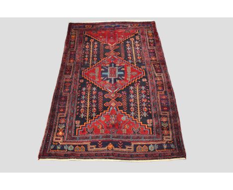 Hamadan carpet, north west Persia, second half 20th century, 9ft. 2in. x 5ft. 1in. 2.80m. x 1.55m. Dark blue/black field with