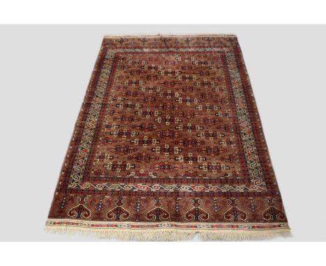 Yomut Turkmen carpet, Turkmenistan, second half 20th century, 9ft. 10in. x 6ft. 4in. 3m. x 1.93m. Light browny/pink field wit